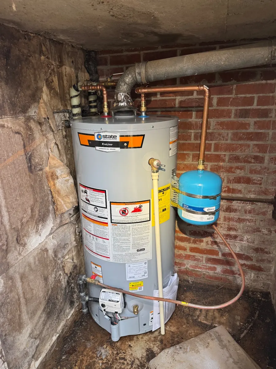 Gas water heater with a blue thermal expansion tank and new copper connections, installed by Three Sons Plumbing